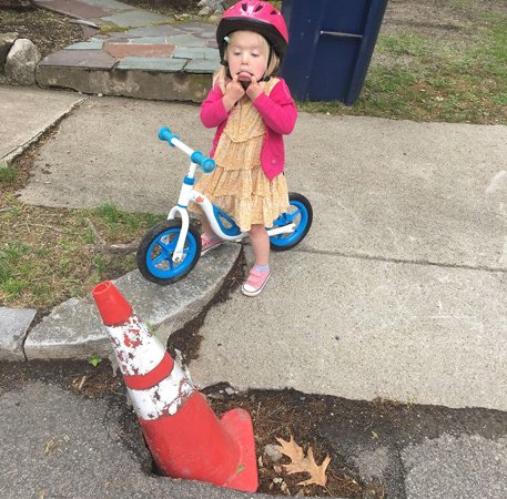 Kid disgusted with pothole