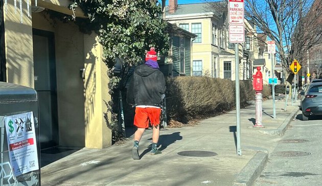 Guy in shorts on coldest day in a long time in Union Square.