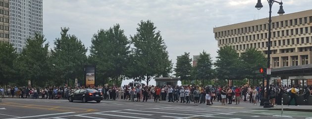 A line of blue people waiting for the Blue Line