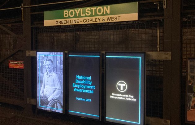 Ads from the MBTA about National Disability Awareness Month at one T stop people in wheelchairs can't use