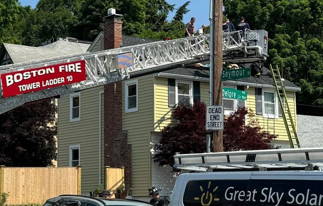 Firefighters working on rescuing solar-panel installer in Roslindale