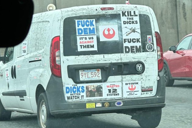 Truck with Rebel Alliance, Confederate stickers on I-93