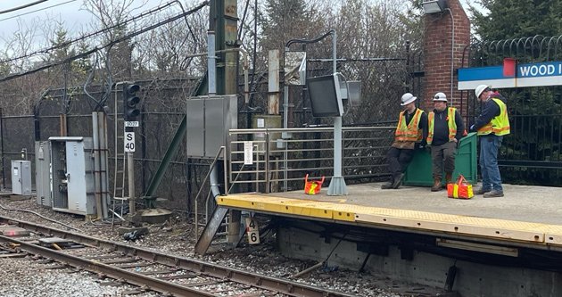 Workers wait for signal to work on signals at Wood Island