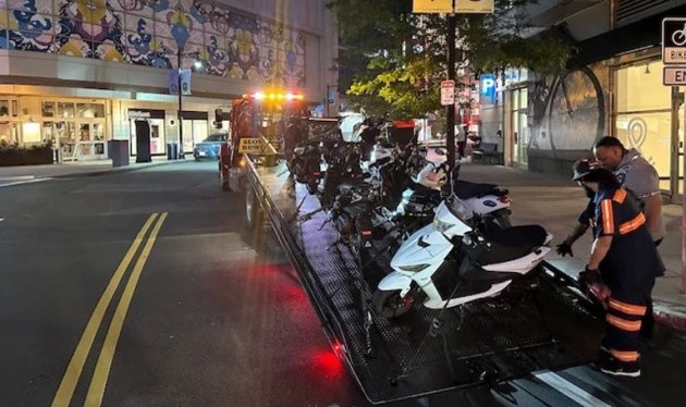Seized scooters about to be towed away