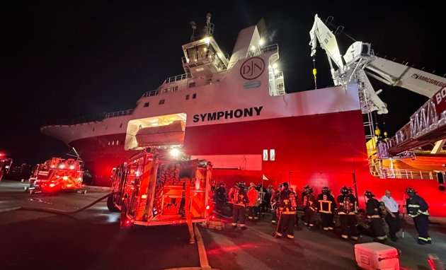 Firefighters going aboard the Symphony