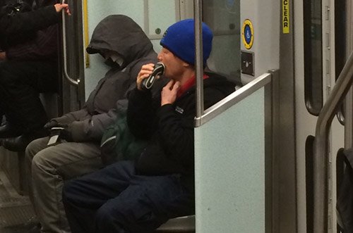 Man shaving on the MBTA's Green Line