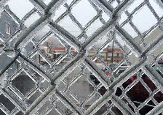 Fence coated in ice