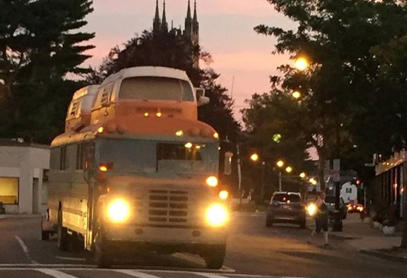 Two microbuses atop a school bus