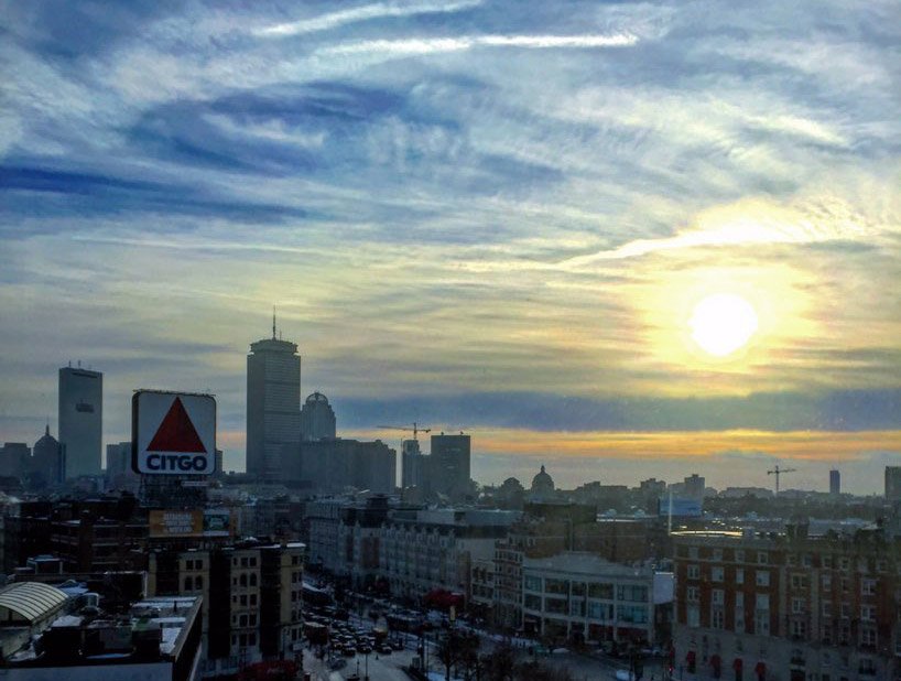 Sun rising over the Citgo sign and Kenmore Square in Boston