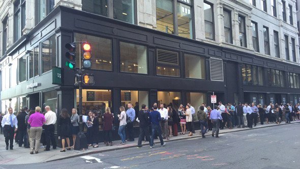 People standing around for a salad in downtown Boston