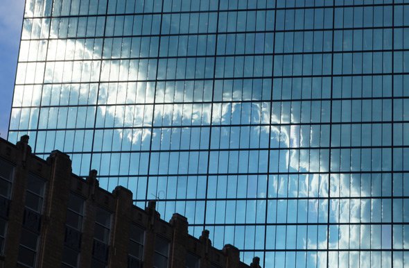 Clouds reflected in Boston's John Hancock Building after a downpour