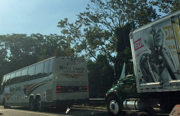 A bus and a truck stuck on Storrow Drive