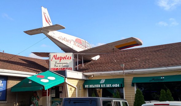 Crashed plane on roof of Napoles on Bennington Street in East Boston