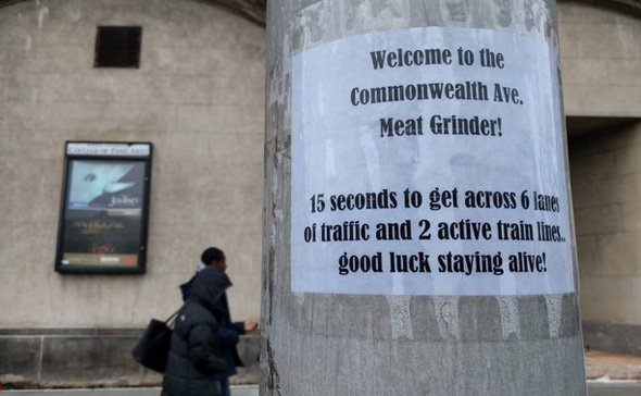 Sign warning BU students about not getting killed crossing Commonwealth Avenue