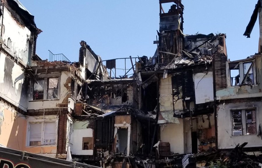 Remains of a Hemenway apartment building being torn down