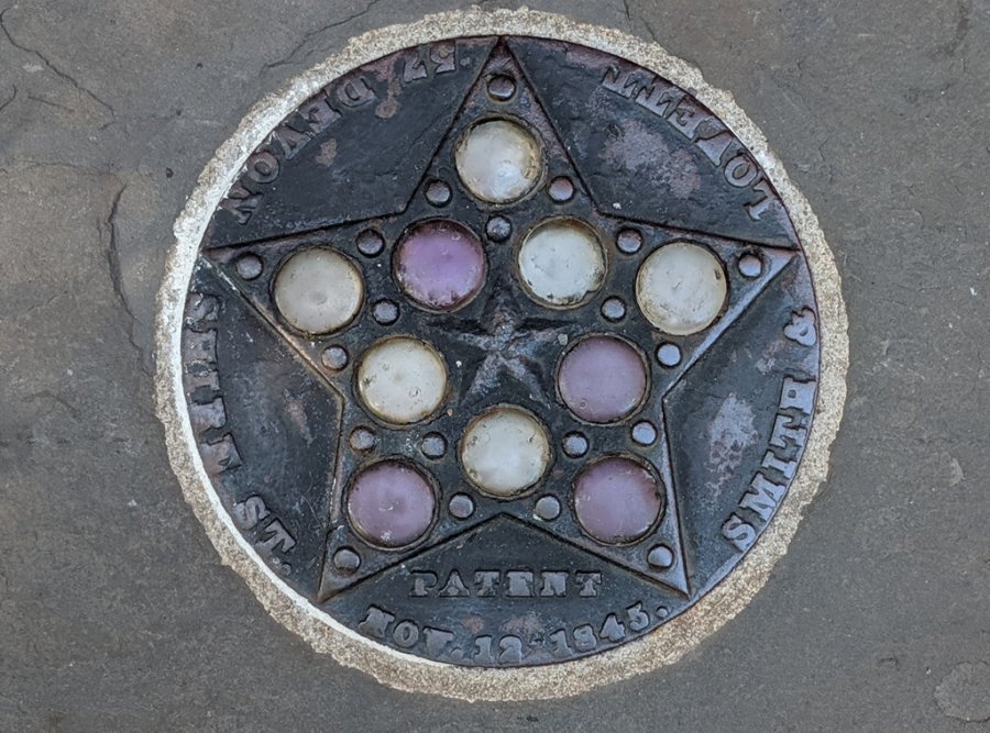 Old coal chute cover on East Concord Street in the South End