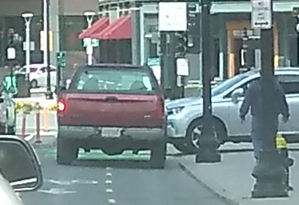 Pickup truck travels down a dedicated bike lane in Boston