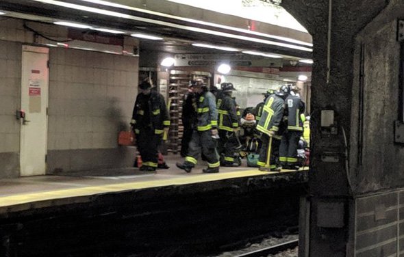 Firefighters getting ready to go on tracks