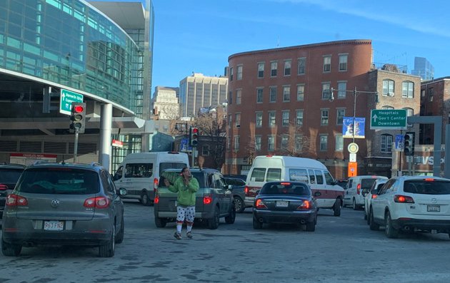 Guy directing traffic at Charles Circle