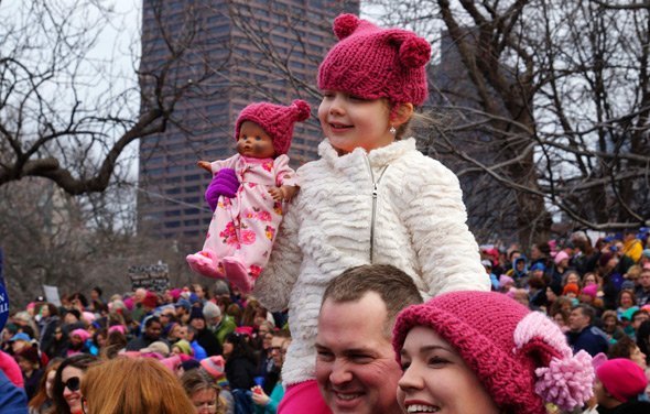 Protesters on Boston Common, including a doll