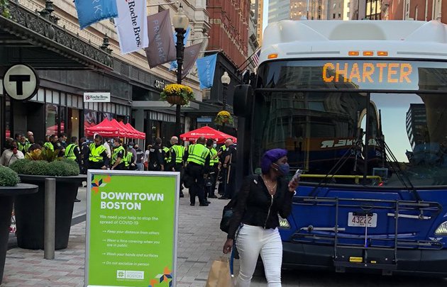 Bus bearing police officers in Downtown Crossing