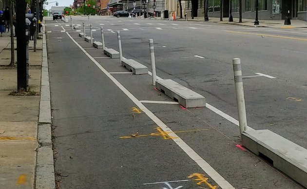 New concrete barriers along bike lane on Massachusetts Avenue