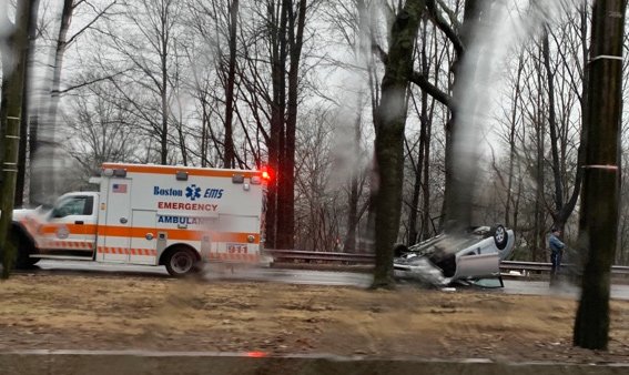 Flipped car on VFW Parkway in West Roxbury