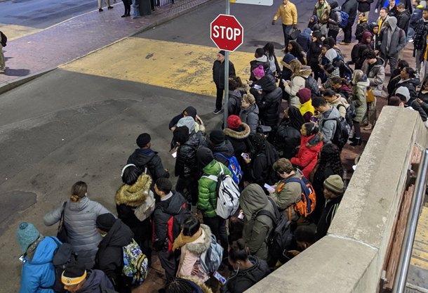 Horde waiting for a 32 bus at Forest Hills