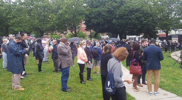 People at vigil for stabbed rabbi