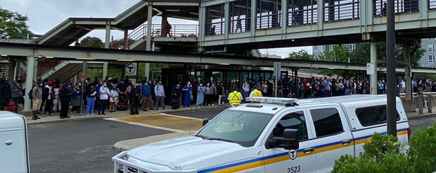 People waiting for non-existent shuttle bus at JFK/UMass