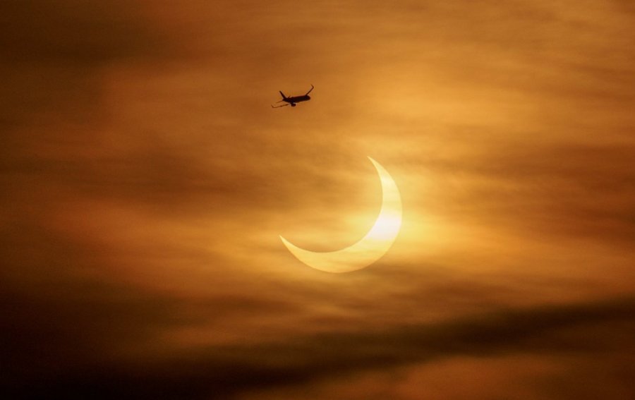 Morning eclipse, with jet