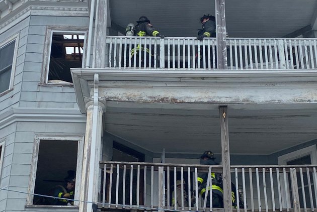 Firefighters at Magnolia Street fire scene