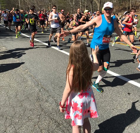 Boston Marathon runners and girl in Ashland