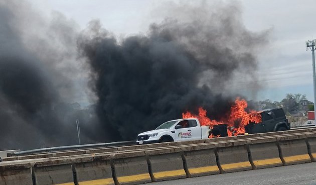 Flaming pickup and SUV