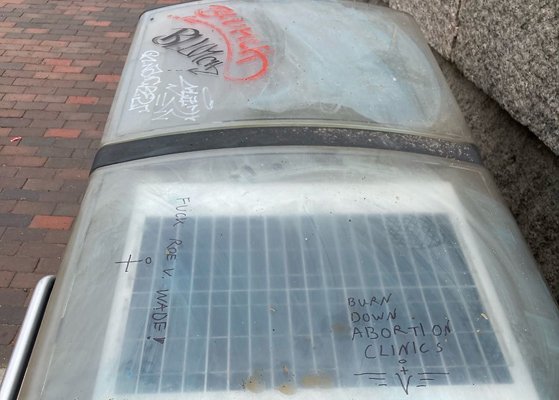 Anti-Roe scrawling atop Roslindale trash receptacle