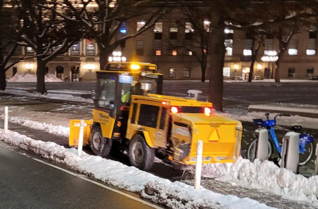 Bobcat clearing Massachusetts Avenue bike lane