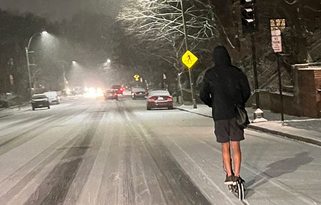 Guy on a scooter in the snow