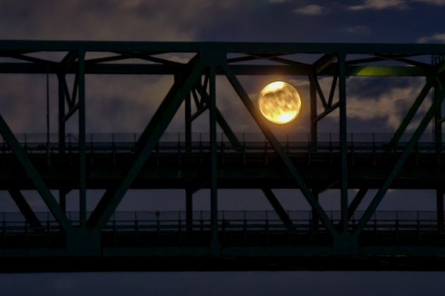 Moon rising through the Tobin Bridge