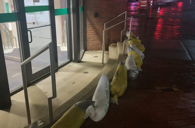 Sandbagged storefront in Harvard Square