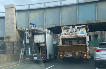 Two trucks under one Storrow bridge