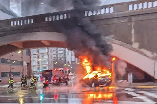 Flaming car across from the Museum of Science