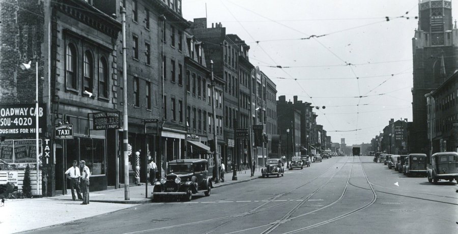 Street scene with cab company in old Boston