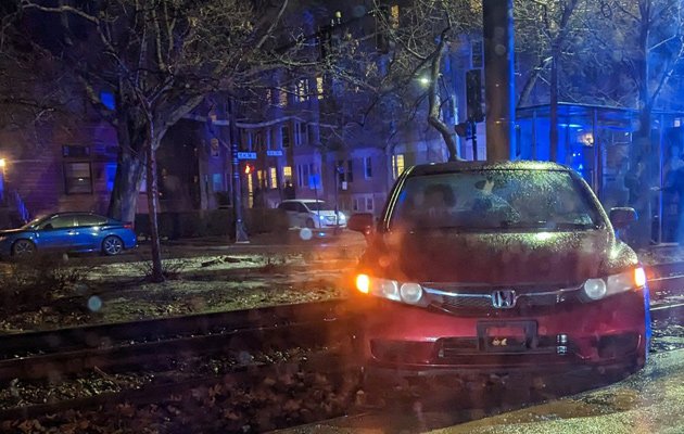 Car on Green Line tracks along Beacon Street