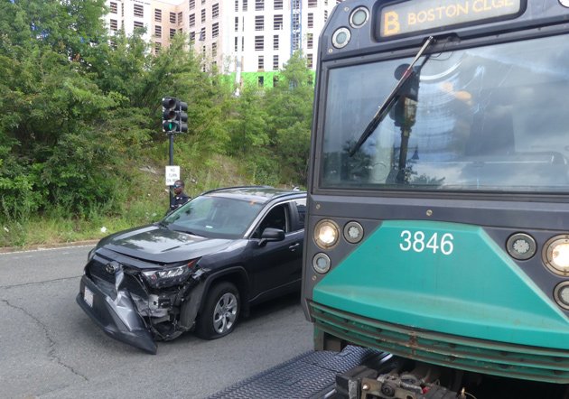 Smashed up car next to the trolley it turned in front of