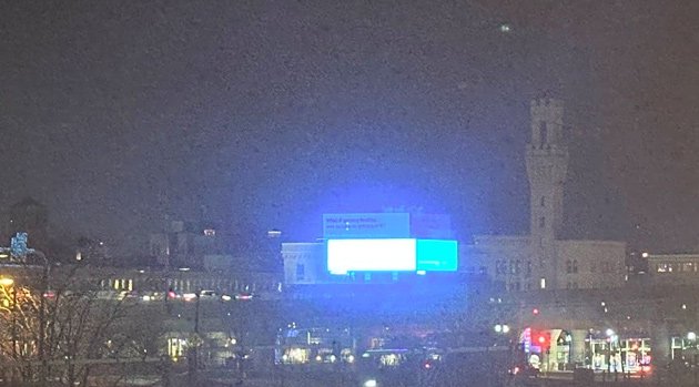 A very bright billboard at Albany Street and Frontage Road