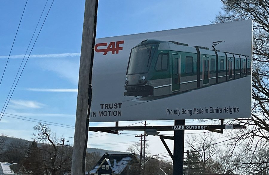 Sign advertising an Elmira Heights factory that will soon be making Green Line trolleys