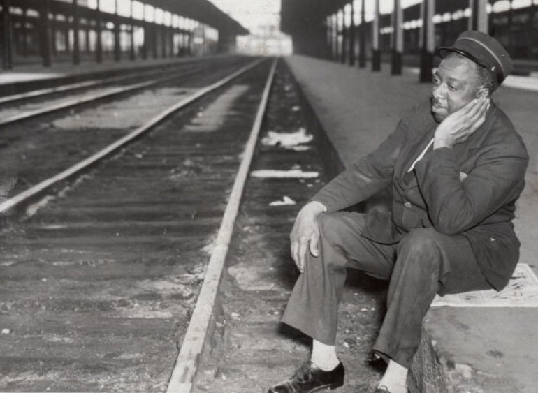 Redcap Charlie Hughes of Roxbury sits dejectedly at South Station