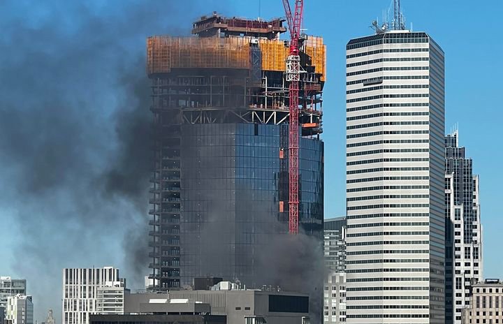 Smoke from flaming construction material