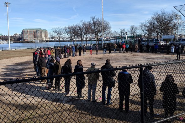 People gathered in a ring in the North End to commemorate the Great Molassses Flood