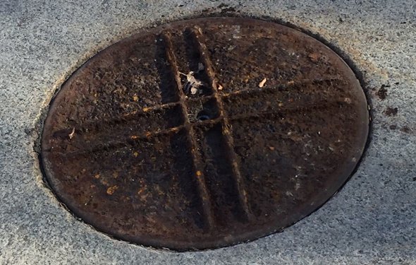 Upside-down manhole cover